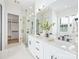 Elegant bathroom features a glass shower, double vanity with stone countertops, and modern fixtures for a spa-like experience at 3949 Plainview Rd, Charlotte, NC 28208