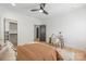 Cozy bedroom featuring an ensuite, ceiling fan, and ample closet space at 3949 Plainview Rd, Charlotte, NC 28208