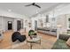 Bright living room with an open layout, hardwood floors, and contemporary design, seamlessly connecting to the kitchen at 3949 Plainview Rd, Charlotte, NC 28208