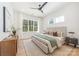 Serene bedroom featuring a luxurious bed, dresser, and ample natural light for a relaxing retreat at 3949 Plainview Rd, Charlotte, NC 28208
