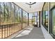 Covered porch with a ceiling fan, offering outdoor relaxation and views of the yard at 3949 Plainview Rd, Charlotte, NC 28208