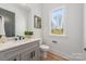 Half bathroom with gray vanity, quartz countertop, and modern fixtures at 3953 Plainview Rd, Charlotte, NC 28208