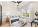 Bright bedroom features a modern ceiling fan, natural light, and hardwood floors at 3953 Plainview Rd, Charlotte, NC 28208