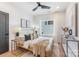 Stylish bedroom featuring a comfortable bed, contemporary decor, natural light, and a dark accent wall at 3953 Plainview Rd, Charlotte, NC 28208