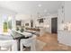 Open-concept design connects the dining area, kitchen, and living room for seamless entertaining at 3953 Plainview Rd, Charlotte, NC 28208