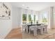 Bright dining room boasts large windows and wood floors at 3953 Plainview Rd, Charlotte, NC 28208