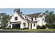 New construction home has a black garage door, white facade, and manicured lawn at 3953 Plainview Rd, Charlotte, NC 28208