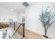 Hallway featuring steel railing and white walls at 3953 Plainview Rd, Charlotte, NC 28208
