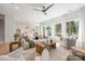 Open-concept living room boasts large windows, hardwood floors, and seamless flow to the kitchen at 3953 Plainview Rd, Charlotte, NC 28208