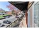 Cozy balcony featuring wood floors and black metal railings with a view of the parking lot at 452 S Main St # F, Davidson, NC 28036