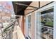 Balcony featuring a view of parking and awning for shade at 452 S Main St # F, Davidson, NC 28036