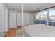 Bedroom featuring closet space, a four-poster bed, and a balcony view at 452 S Main St # F, Davidson, NC 28036