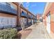 Exterior view of the townhome buildings showcasing balconies and pedestrian walkways at 452 S Main St # F, Davidson, NC 28036