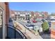 View of the building from a balcony overlooking a parking lot on a sunny day at 452 S Main St # F, Davidson, NC 28036