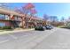 Apartment complex with multiple units and parking spaces on a sunny day at 452 S Main St # F, Davidson, NC 28036