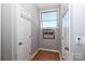 Hallway with hardwood floors and a window with a view at 452 S Main St # F, Davidson, NC 28036