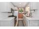Efficient kitchen with white cabinetry, stainless steel appliances, and modern countertops at 452 S Main St # F, Davidson, NC 28036