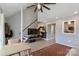 Bright living area featuring an open staircase, stylish décor, and pass-through window to the kitchen at 452 S Main St # F, Davidson, NC 28036