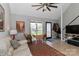 Comfortable living room with large windows, cozy seating, and modern decor accents at 452 S Main St # F, Davidson, NC 28036