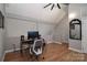 Office with hardwood floors, desk, computer, mirror, and natural lighting at 452 S Main St # F, Davidson, NC 28036