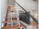 Staircase with wood treads, modern railings, and an open design at 452 S Main St # F, Davidson, NC 28036