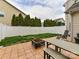 Backyard patio with a dining table, grill, and well-maintained yard at 4708 Chantress Ln, Monroe, NC 28110