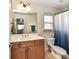 Bright bathroom with a large mirror, double vanity, and tile flooring at 4708 Chantress Ln, Monroe, NC 28110
