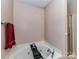 Bright bathroom featuring a soaking tub, shower, and neutral wall colors at 4708 Chantress Ln, Monroe, NC 28110