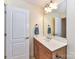 Bathroom with a vanity, single sink, and modern fixtures at 4708 Chantress Ln, Monroe, NC 28110