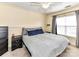 Bedroom with queen bed, ceiling fan, and neutral decor at 4708 Chantress Ln, Monroe, NC 28110