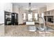 Open kitchen featuring stainless steel appliances, granite countertops, and modern design at 4708 Chantress Ln, Monroe, NC 28110