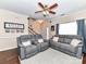 Inviting living room showcasing hardwood floors, comfortable seating, and staircase access at 4708 Chantress Ln, Monroe, NC 28110