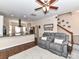 Open-concept living area showcasing hardwood floors, stairs, and views of the kitchen at 4708 Chantress Ln, Monroe, NC 28110