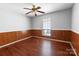 Bedroom with a ceiling fan, hardwood floors, and a large window at 4715 Cricklewood Ln, Charlotte, NC 28212