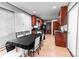 Kitchen with tile floor, wood cabinets, and a table with a black tablecloth at 4715 Cricklewood Ln, Charlotte, NC 28212