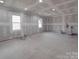 Unfinished room featuring drywall and recessed lighting at 5687 Putuptoe Pl, Norwood, NC 28128