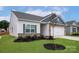 Charming single-Gathering home showcasing a manicured lawn and stone accents on the facade at 5712 Skinny Ln, Charlotte, NC 28215