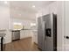 Bright, modern kitchen with stainless steel appliances, granite countertops and hardwood floors at 5712 Skinny Ln, Charlotte, NC 28215