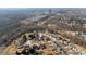 Neighborhood aerial view with trees, pond, and winding pathways at 576 Putting Dr, Fort Mill, SC 29715
