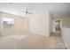 Large, bright room featuring carpet, ceiling fan, neutral walls and baseboards, and big windows at 576 Putting Dr, Fort Mill, SC 29715