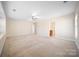 Bright, expansive bedroom with neutral walls and carpet, ready for personalization and decor at 576 Putting Dr, Fort Mill, SC 29715