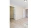 Empty bedroom with beige walls, carpet, and baseboards with two open door frames leading to other rooms at 576 Putting Dr, Fort Mill, SC 29715