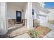 Welcoming front porch with stone accents and a stylish front door at 576 Putting Dr, Fort Mill, SC 29715
