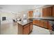 Well-lit kitchen featuring an island, and seamless access to living room at 576 Putting Dr, Fort Mill, SC 29715