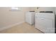 Tile laundry room with bright walls and two appliances at 576 Putting Dr, Fort Mill, SC 29715