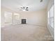 Bright living room with a fireplace and open layout at 576 Putting Dr, Fort Mill, SC 29715