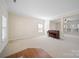 Open living room with ample natural light and neutral carpet at 576 Putting Dr, Fort Mill, SC 29715