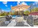 Enjoy outdoor dining by the pool in this charming backyard setting at 590 County Line Rd, Stony Point, NC 28678