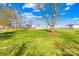 Expansive backyard features green grass, shed, above ground pool, and mobile home at 590 County Line Rd, Stony Point, NC 28678