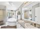Bright bathroom with a double vanity, soaking tub, and separate shower at 590 County Line Rd, Stony Point, NC 28678